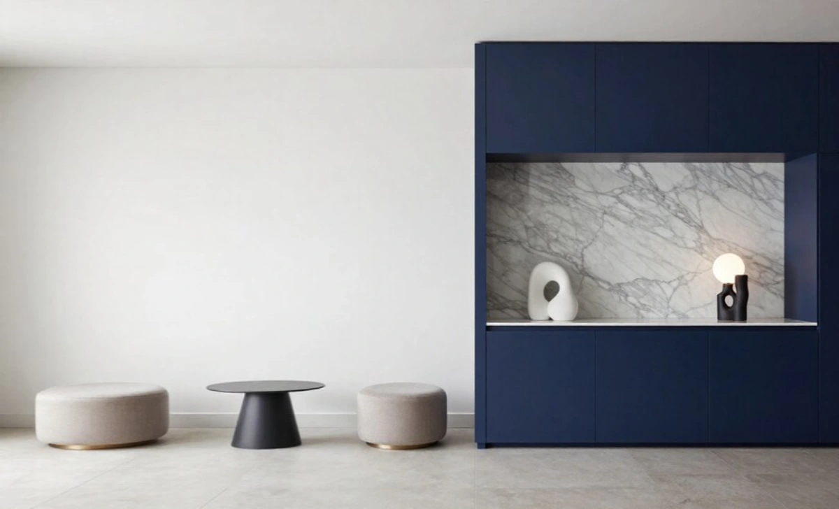 Maximalist luxury living room with bold jewel-toned colors, layered velvet textures, sculptural chandelier, and dramatic gallery wall